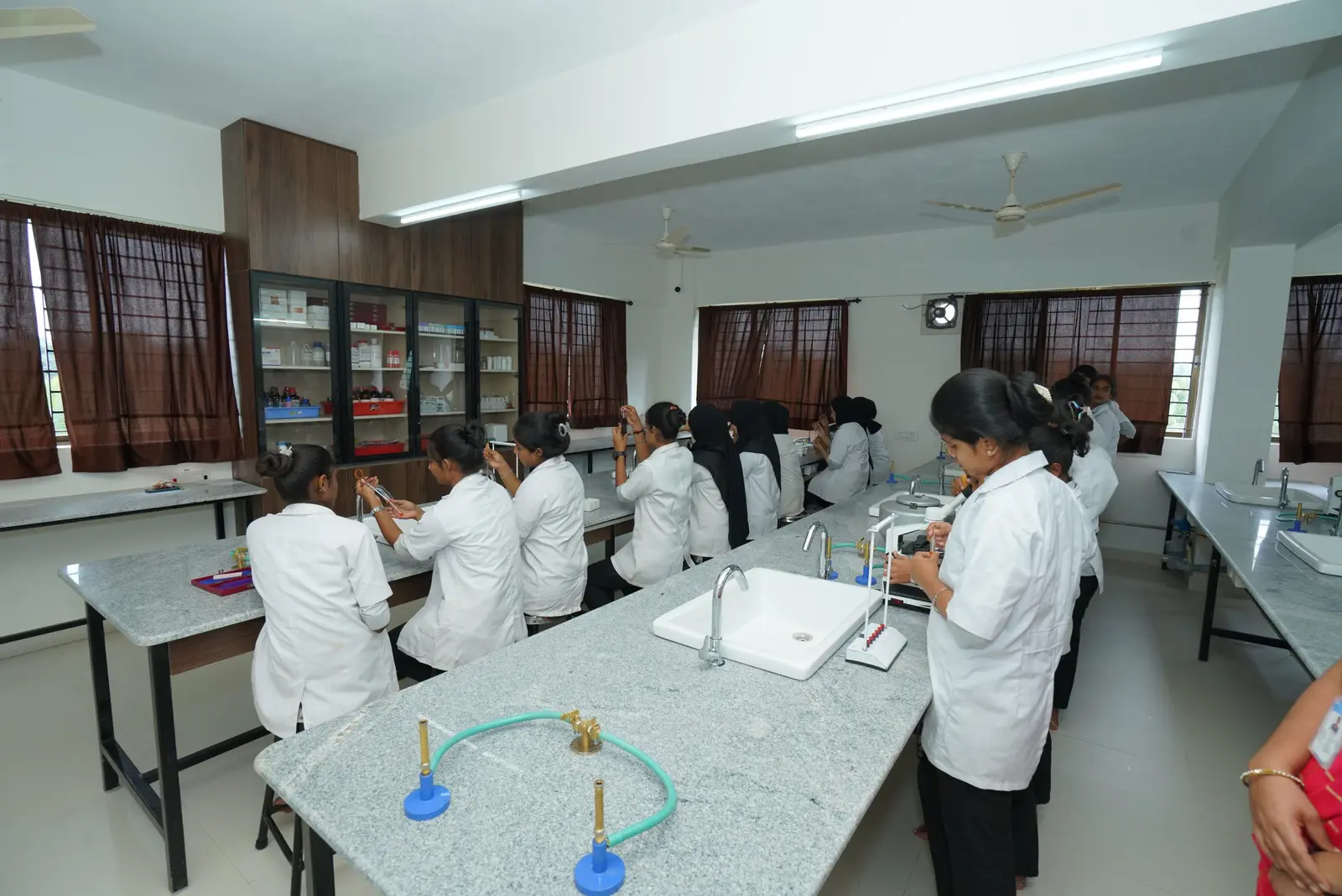 Students receiving practical instruction in the pathology laboratory at Netra Jyothi Institute