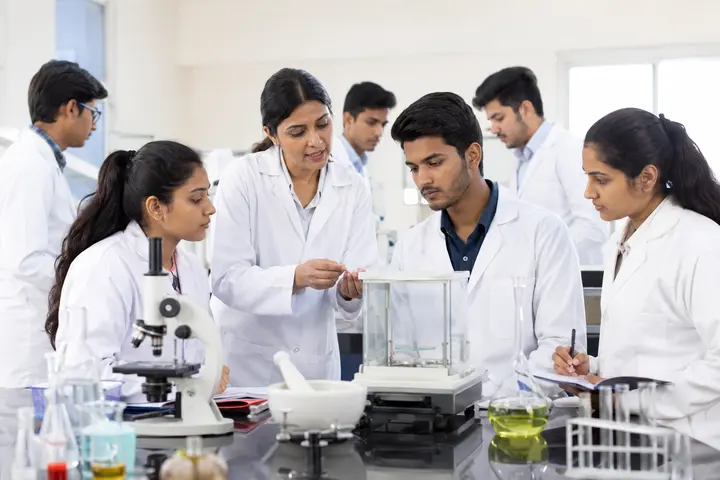 Pharmacy students learning formulation and quality-control techniques in a teaching laboratory